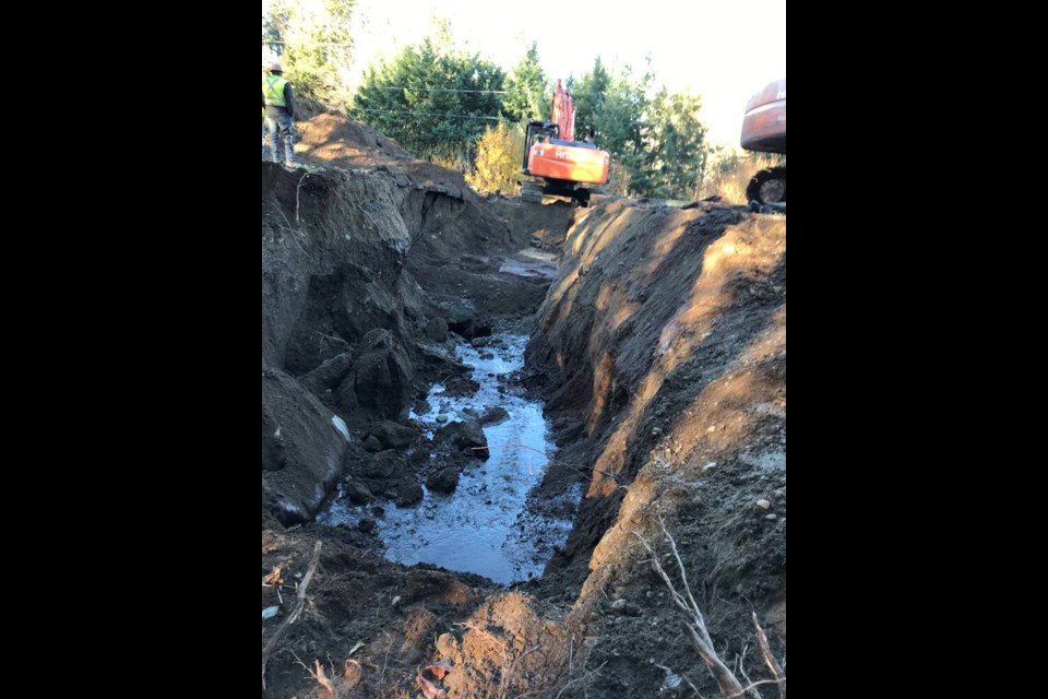 Excavation work continued on Highway 19 about four kilometres north of Nanaimo on Saturday, Nov. 20, 2021, after heavy rain and flooding led to damage this week. MINISTRY OF TRANSPORTATION