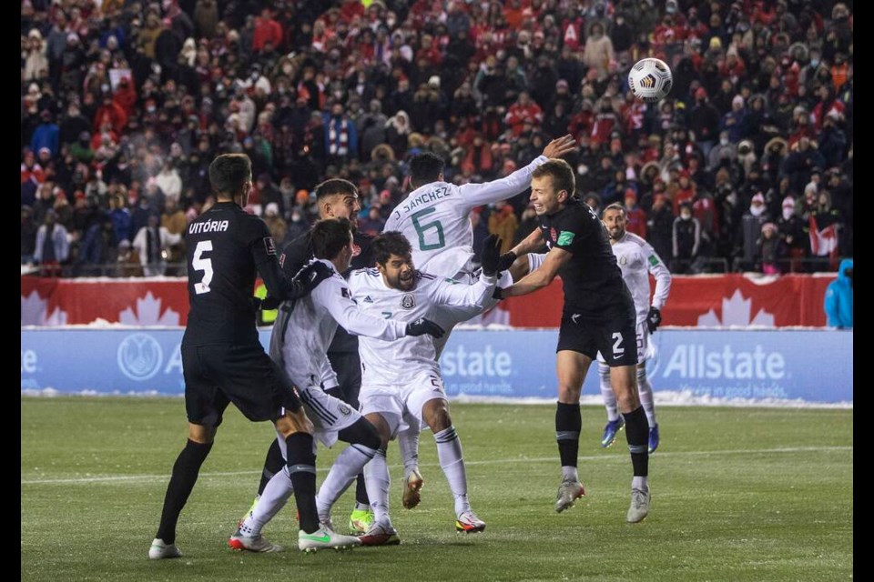 Canada and Mexico players vie for the ball during second half World Cup Qualifiers in Edmonton, Tuesday, Nov. 16, 2021. THE CANADIAN PRESS/Jason Franson 