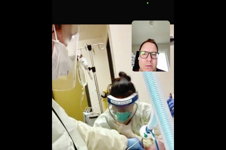 Victoria-based ICU physician Dr. Adam Thomas coaches a family doctor in a remote area through a critical procedure via a video link. The location, physicians and procedure cannot be identified to ensure patient privacy. SUBMITTED