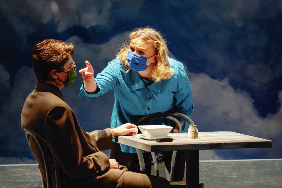  “Excuse me, are you going to get that?” Jean (Jane Rees) says to the unresponsive Gordon (Ryan Kniel) at the café. Dead Man’s Cell Phone runs live in-person at UVic’s Phoenix Theatre and livestreams online until November 27, 2021. Credit Dean Kalyan.