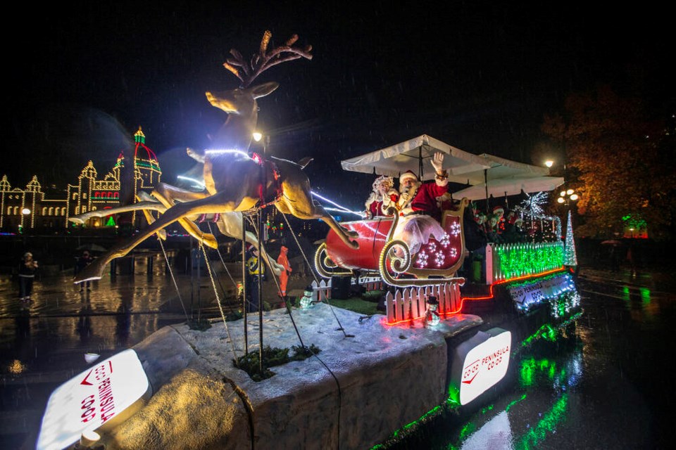 Santa Claus and Mrs. Claus ride along Belleville Street in the Peninsula Co-op Santa Light Parade in Victoria. DARREN STONE, TIMES COLONIST. Nov. 27, 2021 