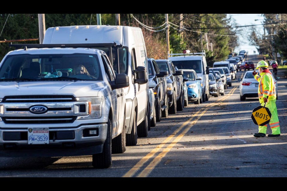 Vehicles line up at B.C. Ferries'  Brentwood Bay terminal on Tuesday for the trip to Mill Bay, avoiding the Malahat, which was only open to single-lane alternating traffic after closing overnight. DARREN STONE, TIMES COLONIST 