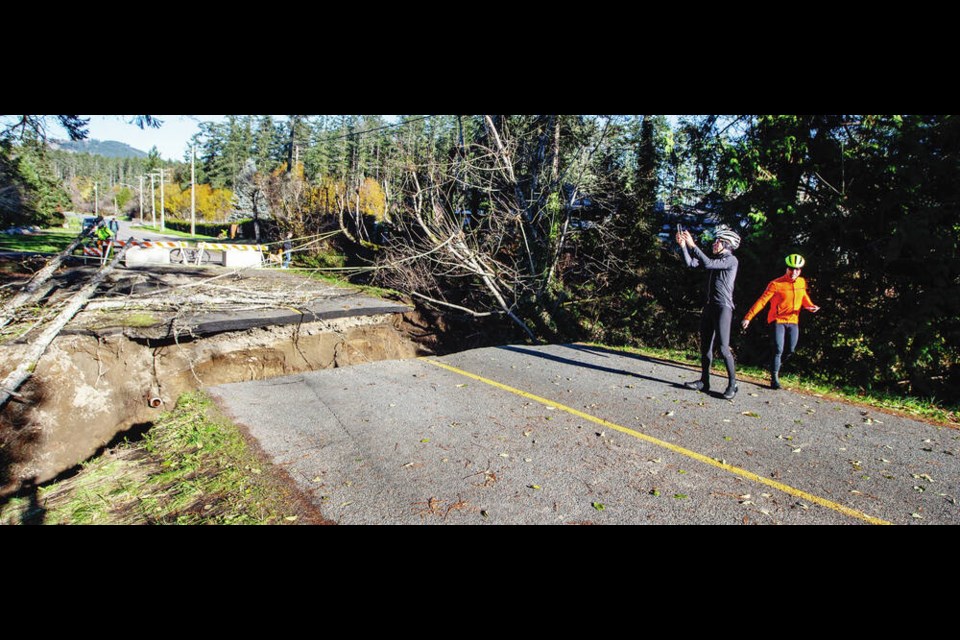 In North Saanich, a creek cut through Chalet Road, leaving a two-metre exposed trench across the roadway. The municipality said Tuesday that water service in the neighbourhood had been restored Monday night and that the roadway was still being assessed. DARREN STONE, TIMES COLONIST 