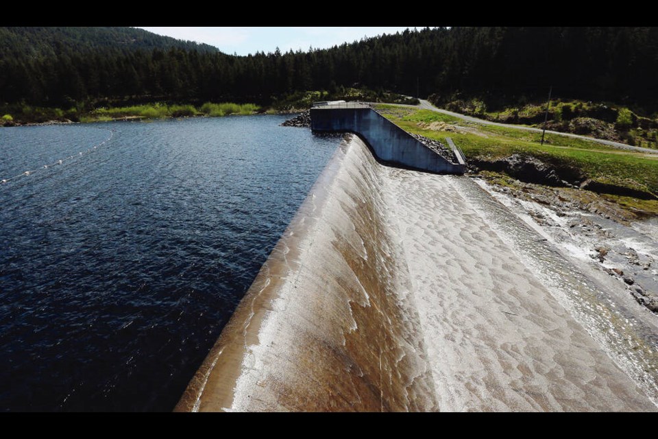 Water flows over the spillway at the Sooke Lake reservoir. TIMES COLONIST 