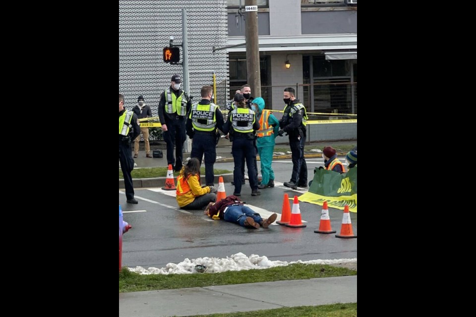 Police arrest one of the protesters blocking the southbound lanes of Douglas Street at Burnside Road East while others hold their position, on Monday, Jan. 10, 2022. ADRIAN LAM, TIMES COLONIST