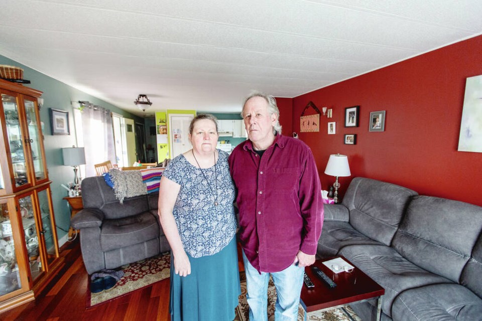Heather and Alan McEwen at their home in the E. George Estates mobile home park.  DARREN STONE, TIMES COLONIST 