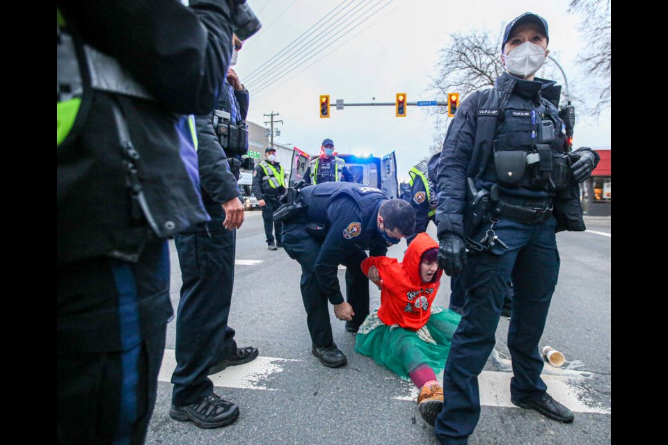 Saanich and Victoria police attend the scene of a protest on Douglas Street between Speed Street and Tolmie Avenue during the morning rush hour on Wednesday. Five people were arrested. ADRIAN LAM, TIMES COLONIST    Jan. 19, 2022