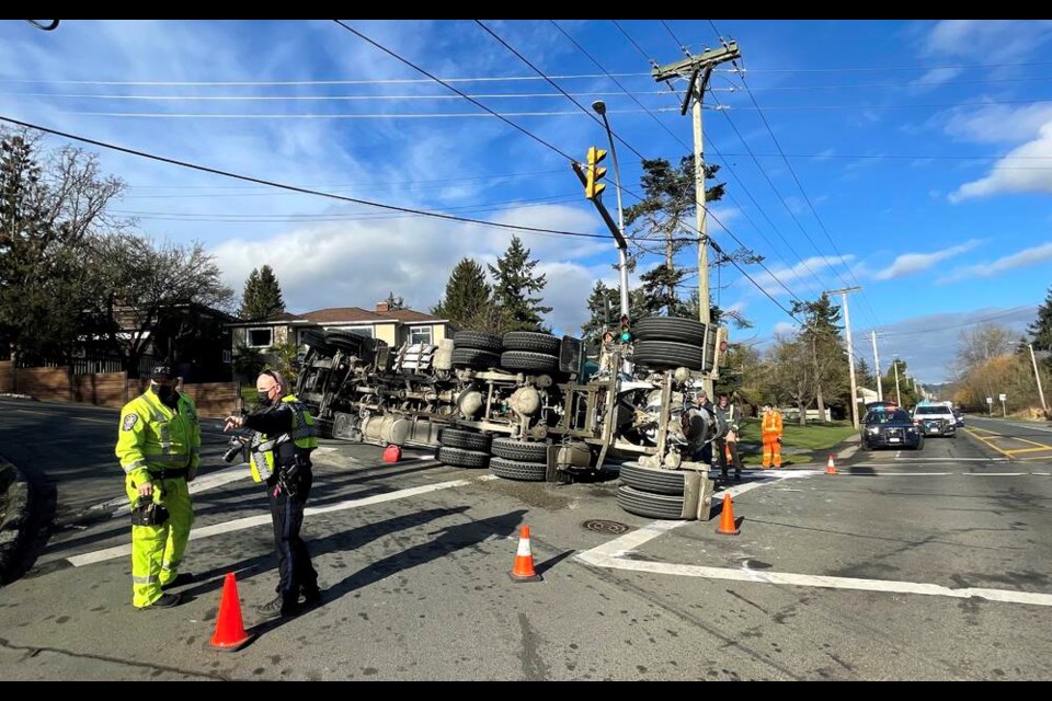 Saanich police are investigating after a fully loaded concrete truck tipped over on Marigold Road on Tuesday, Feb. 15, 2022. ADRIAN LAM, TIMES COLONIST 