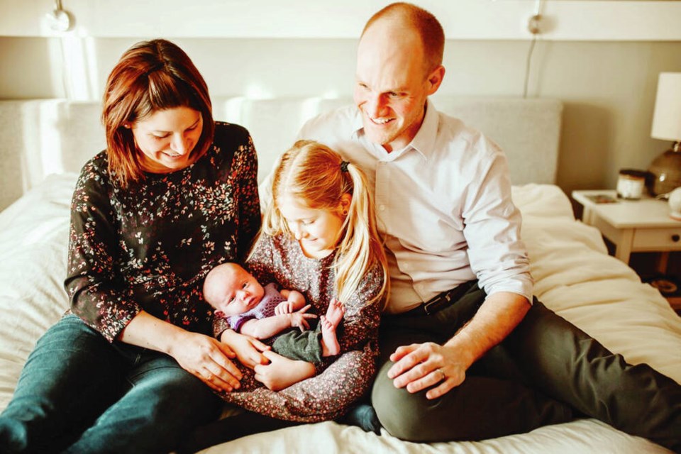 Emily Bruser, Ivy Kleissen, Aoife Kleissen and Dustin Kleissen. Ivy was born after a successful IVF treatment, but Bruser had to travel to Burnaby for egg retrieval and embryo transfers.	PHOTO: Tasha Cline 