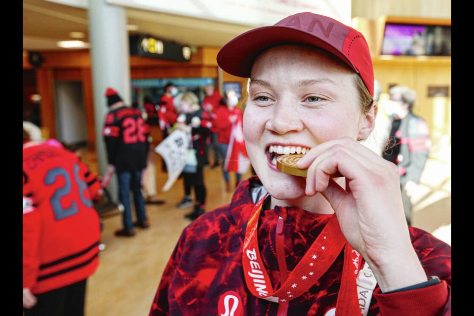 Canadian hockey player Micah Zandee-Hart of Saanichton returns with her Olympic gold medal to a rousing welcome at Victoria International Airport on Monday. ADRIAN LAM, TIMES COLONIST