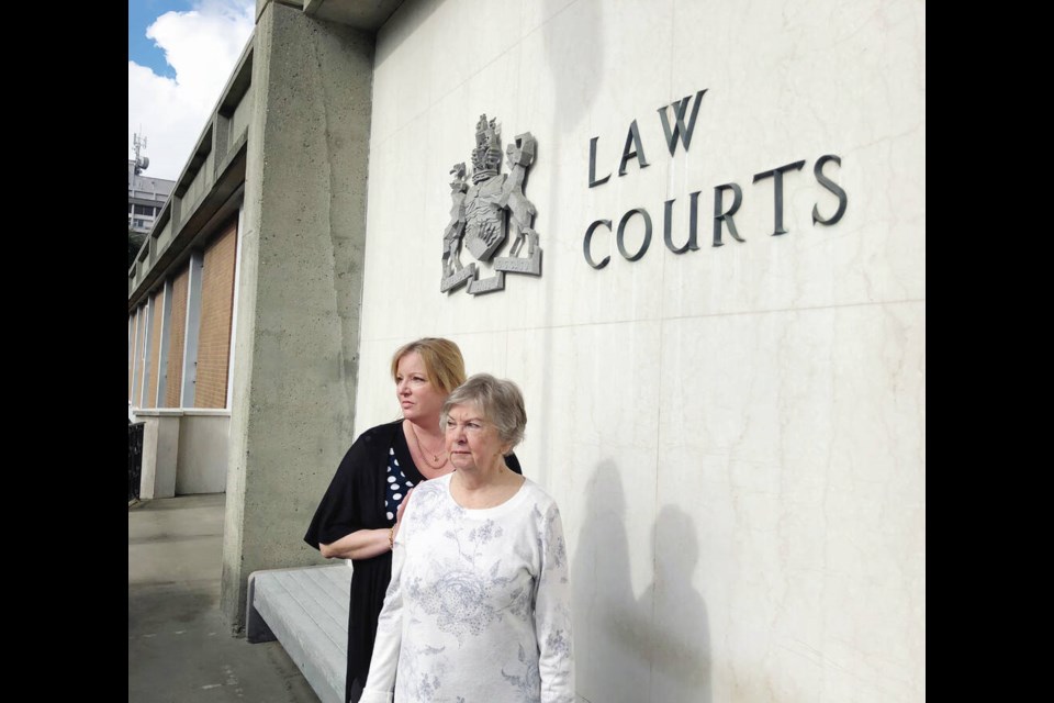 Ellen Ward, mother of Kim and Tracey Ward, with Marnie Green, left, her best friend's daughter outside the Victoria courthouse in February. Kim Ward was killed and Tracy Ward was severely injured when they were hit by a vehicle driven by Anthony Thomas on Aug. 27, 2018, in Central Saanich. TIMES COLONIST