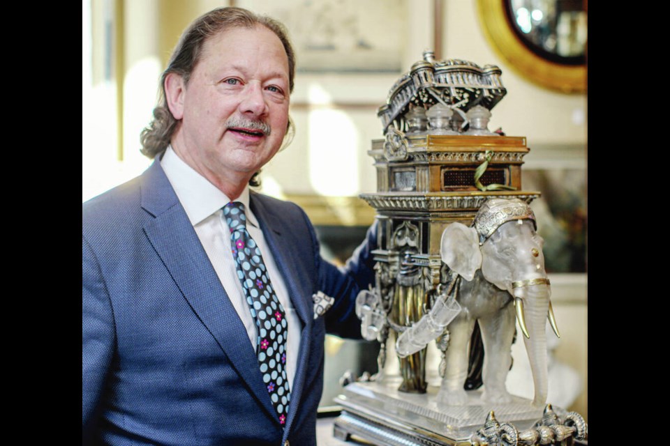 Peter Boyle, owner of Lund's Auction House, with a Baccarat crystal and gilt elephant dating to the late 1800s. It will be auctioned off on April 26, with a sales estimate of $50,000 to $100,000. ADRIAN LAM, TIMES COLONIST 