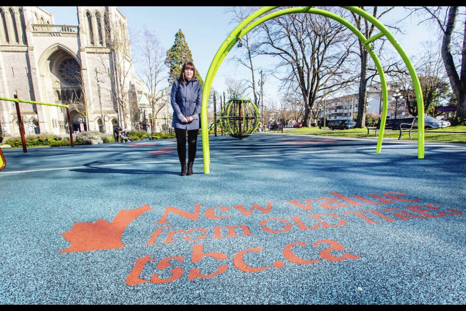 Rosemary Sutton, executive director of Tire Stewardship B.C., stands on a surface made from 4,000 recycled tires in the playground across from Christ Church Cathedral. DARREN STONE, TIMES COLONIST 