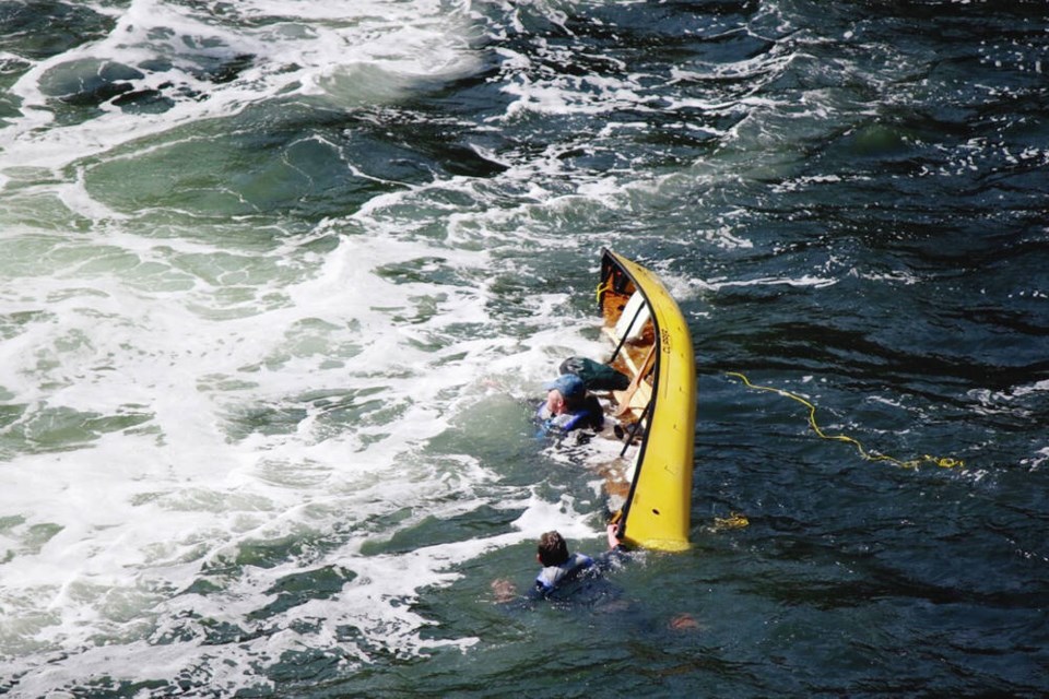 A Nanaimo father and son are dumped into the rough, frigid waters between Mudge Island and ­Vancouver Island after their canoe flipped. A nearby whale-watching vessel came to their rescue.	BROOKE NOWAK 