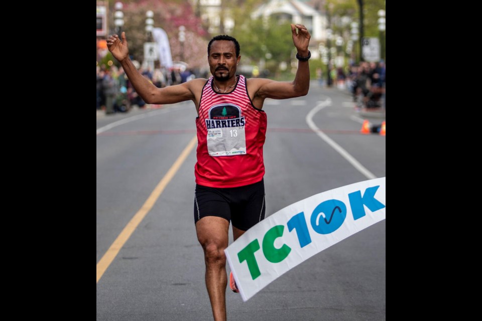 Teferi Kebede Balch crosses the finish line to win the men's category in the Times Colonist 10K in Victoria on Sunday, April 24, 2022. He ran the course in 31 minutes flat. DARREN STONE, TIMES COLONIST