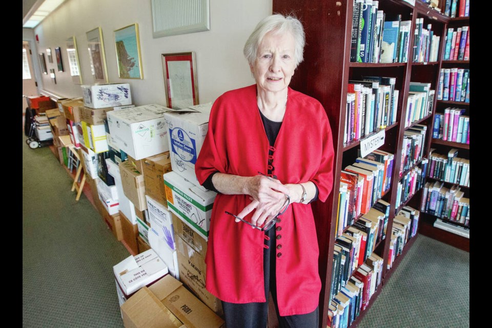 Mary Norton, a volunteer librarian at Somerset House, has collected about 40 boxes of books for the Times Colonist book drive.  DARREN STONE, TIMES COLONIST 