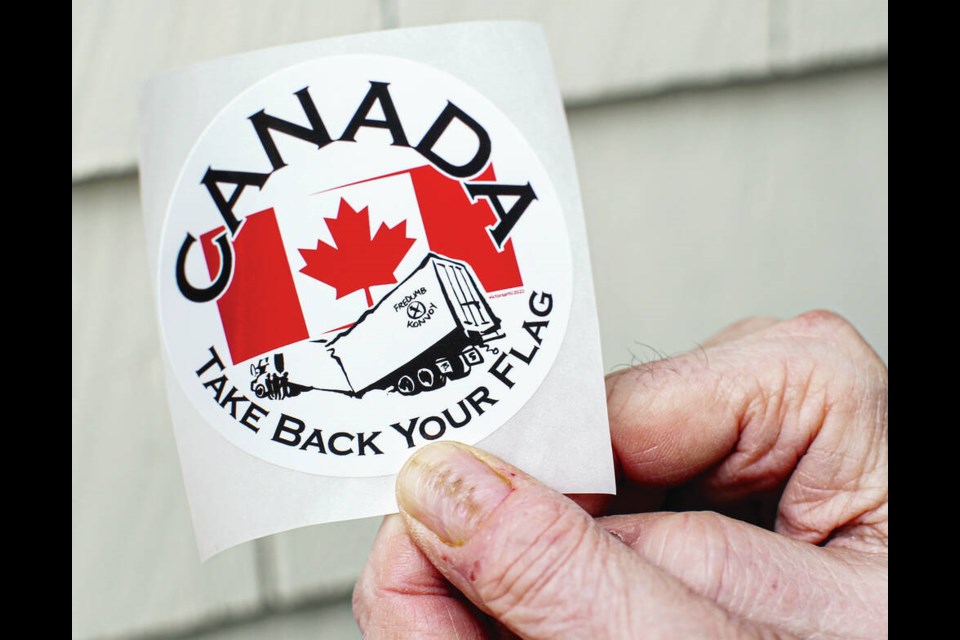 Take Back Your Flag sticker designed by graphic artist Victor Crapnell. ADRIAN LAM, TIMES COLONIST 