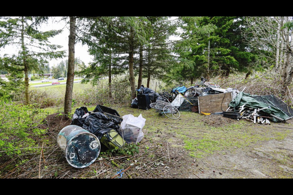 Some of the material left behind at a homeless camp. View Royal Mayor David Screech said there were probably six or seven people living in the triangular bank of land just off the Trans-Canada Highway. ADRIAN LAM, TIMES COLONIST 