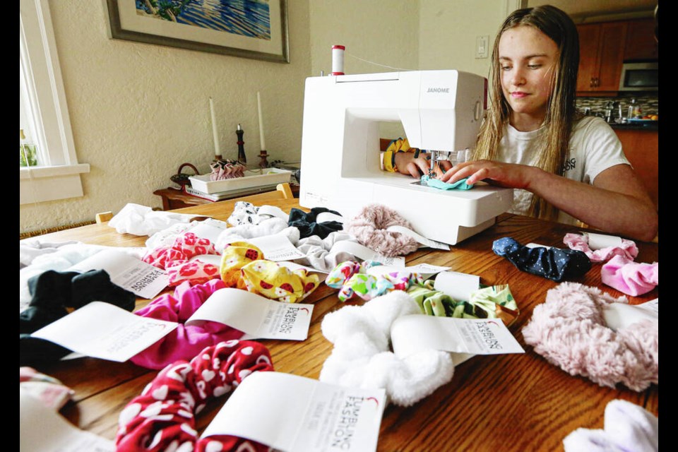 Amira Rudnycka sews hair scrunchies and other products as part of her company Tumbling Fashion, at her home in Victoria. She is taking part in Kidovate, a UVic program for young entrepreneurs, who will be selling their wares in the Bay Centre on April 9.	ADRIAN LAM, TIMES COLONIST 
