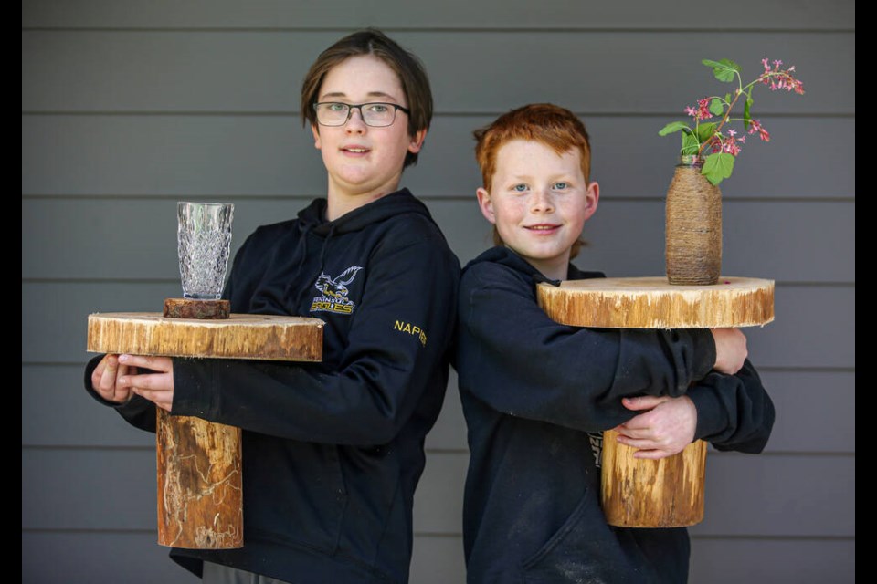 Sid Napier, left, and Nolan Kaercher with some of the products they will be selling on April 9 as part of the Kidovate entrepreneurship program offered free through UVic's Gustavson School of Business. ADRIAN LAM, TIMES COLONIST
