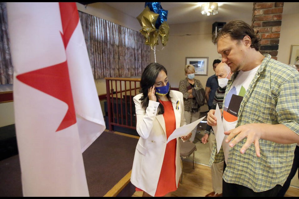 Defence Minister Anita Anand talks with Anton Kirei, a recent refugee from Ukraine, during a tour of the Ukrainian Cultural Centre on Douglas Street on Tuesday. ADRIAN LAM, TIMES COLONIST 