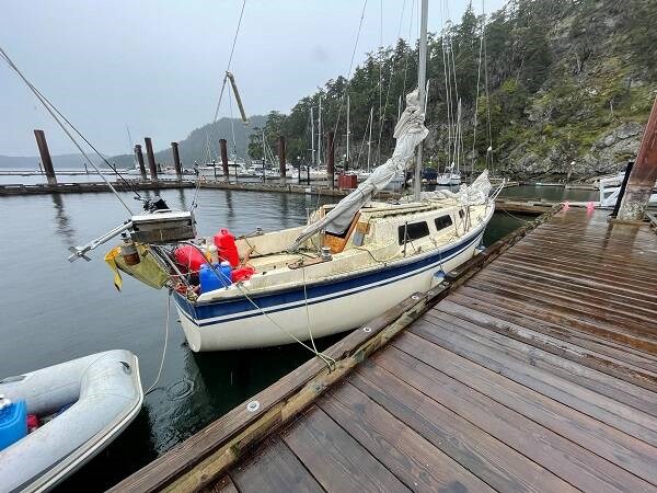 A Canada-U.S. Shiprider crew including RCMP and U.S. Coast Guard staff were in a U.S. Coast Guard vessel when they spotted the 26-foot blue-and-white sailboat west of Stuart Island. VIA RCMP  