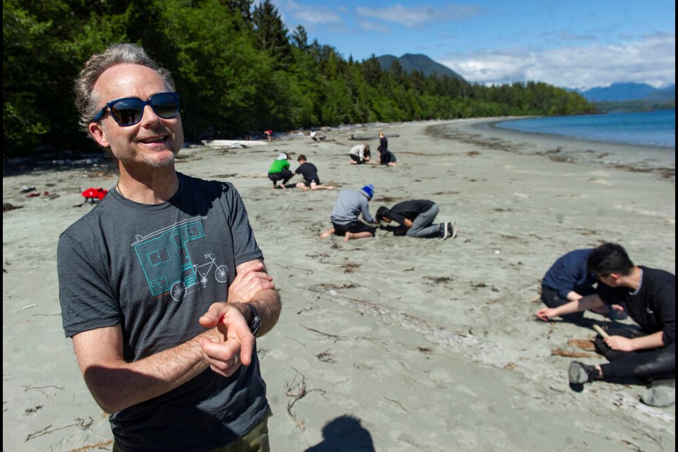 West Point Grey Academy teacher Tom Harding watches students work on a project near the Cedar Coast Field Station on Vargas Island near Tofino. The station offers researchers, students and others the opportunity to live off-grid. JASON PAYNE, PNG