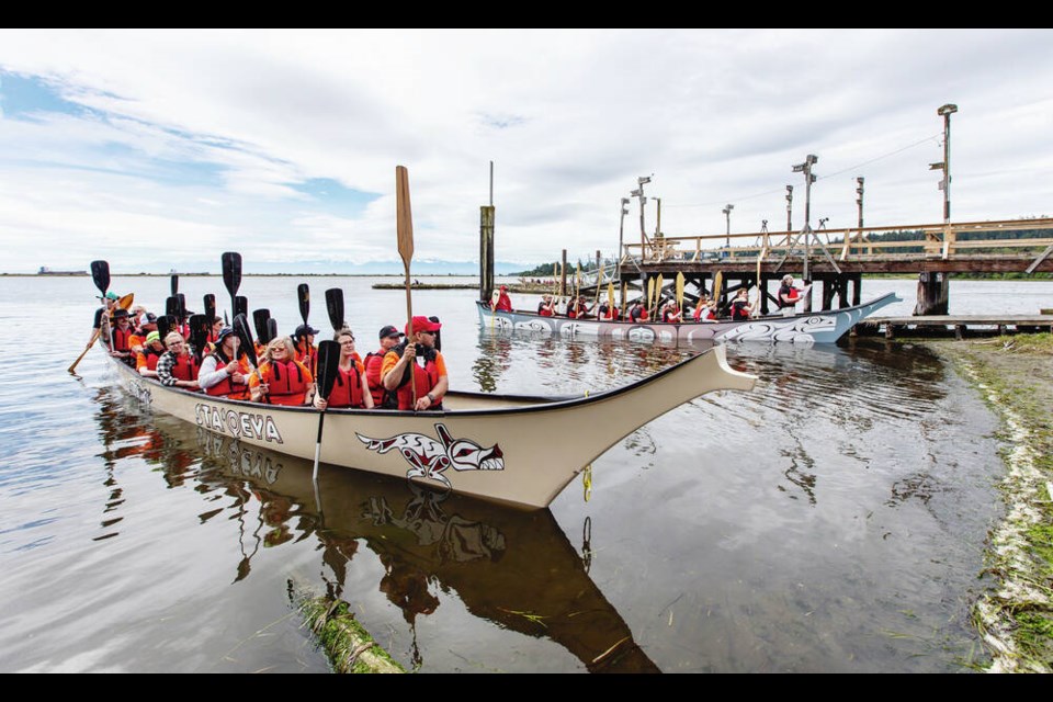 A Traditional Canoe Landing Protocol and welcoming ceremony is held on the shore of Esquimalt Lagoon during National Indigenous Peoples Day celebrations at Royal Roads University on Tuesday.  DARREN STONE, TIMES COLONIST 