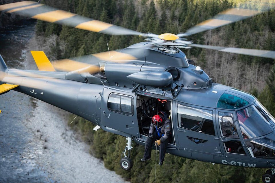 North Shore Rescue volunteer John Blown operates the hoist on Talon Helicopters' Dauphin helicopter in December of 2021. | Grant Baldwin, North Shore Rescue