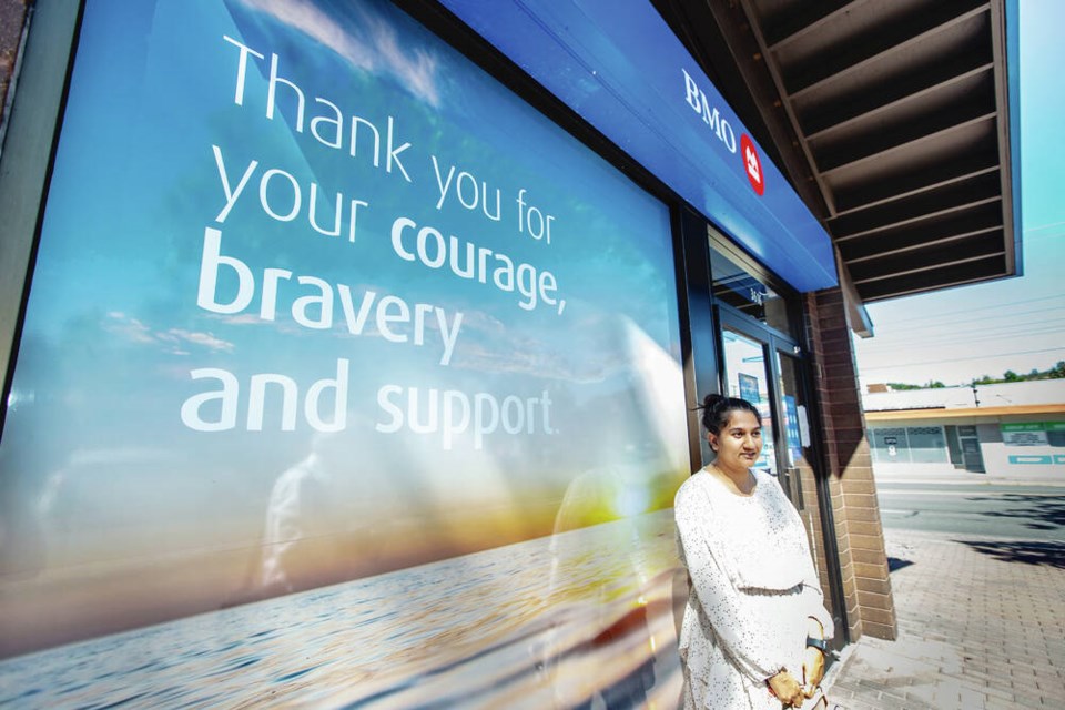 BMO customer Shiwani Gupta at the Shelbourne Street BMO branch, which reopened Tuesday for the first time since a robbery and shootout June 28. DARREN STONE, TIMES COLONIST 