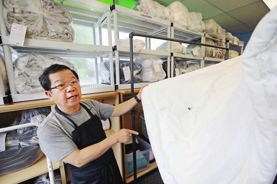 A bullet ripped through the storefront of Squeaky's Laundromat on June 28 and was later found lodged in a folded comforter. Owner Edward Park said he is grateful none of his staff was hurt during the ordeal. ADRIAN LAM, TIMES COLONIST