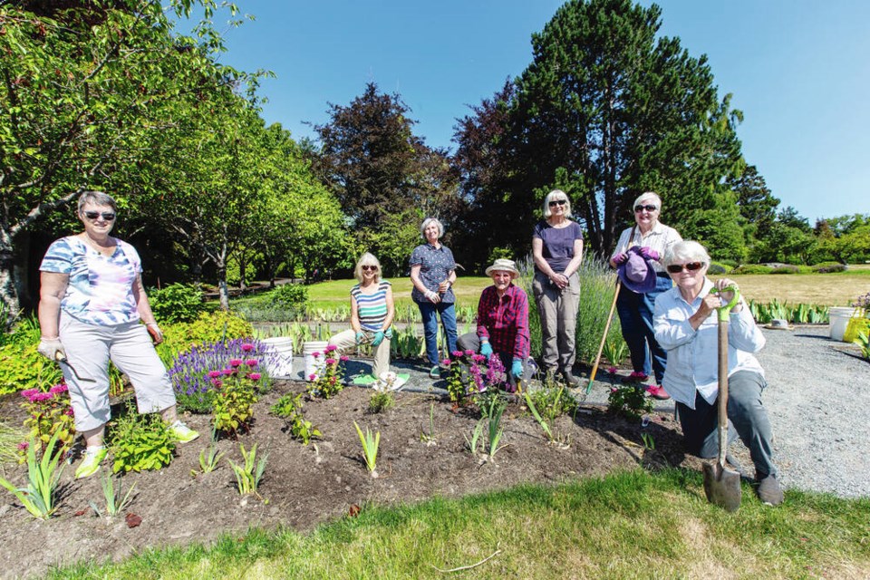 Volunteers from the Friends of Government House, from left, Wendy Fathers, Jo Ferguson, Sam Melnyk, Diane Felker, Mary Lawrence, Diana Knufman and Carol Dancer, in the Victory Over COVID Garden on Government House grounds. DARREN STONE, TIMES COLONIST 