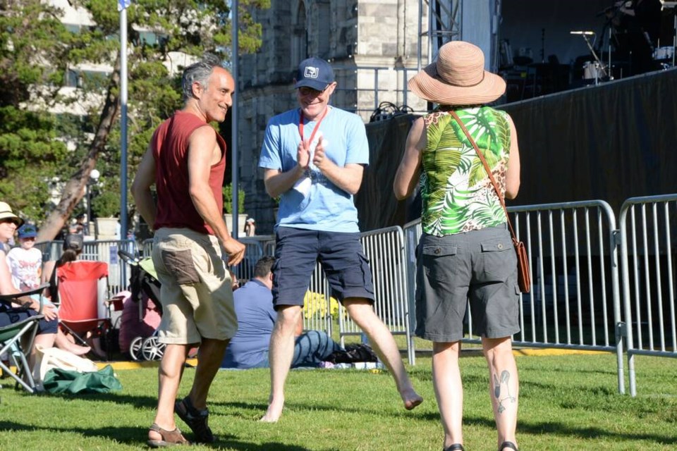 Victoria Symphony CEO Matthew White (centre) dances with attendees during a performance by sea shanty group La Nef. The performance preceded the Steven Page Trio and the Victoria Symphony. NINA GROSSMAN, TIMES COLONIST