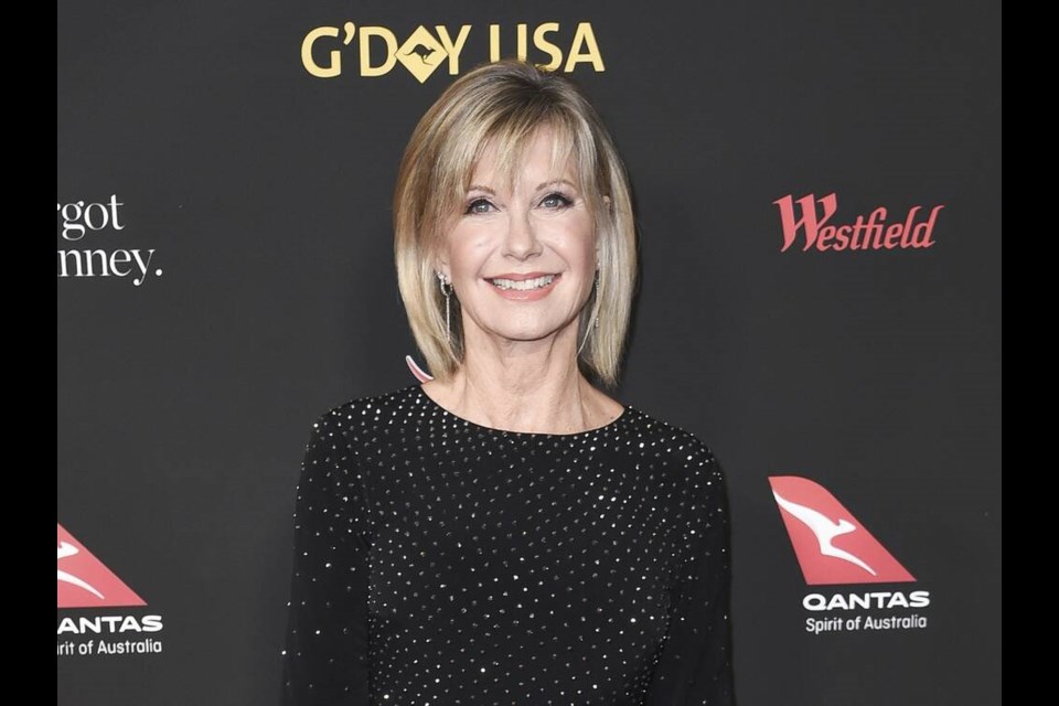 FILE - Actress and singer Olivia Newton-John attends the 2018 G'Day USA Los Angeles Gala in Los Angeles on Jan. 27, 2018. Newton-John, a longtime resident of Australia whose sales topped 100 million albums, died Monday at her southern California ranch, John Easterling, her husband, wrote on Instagram and Facebook. She was 73. (Photo by Richard Shotwell/Invision/AP, File)