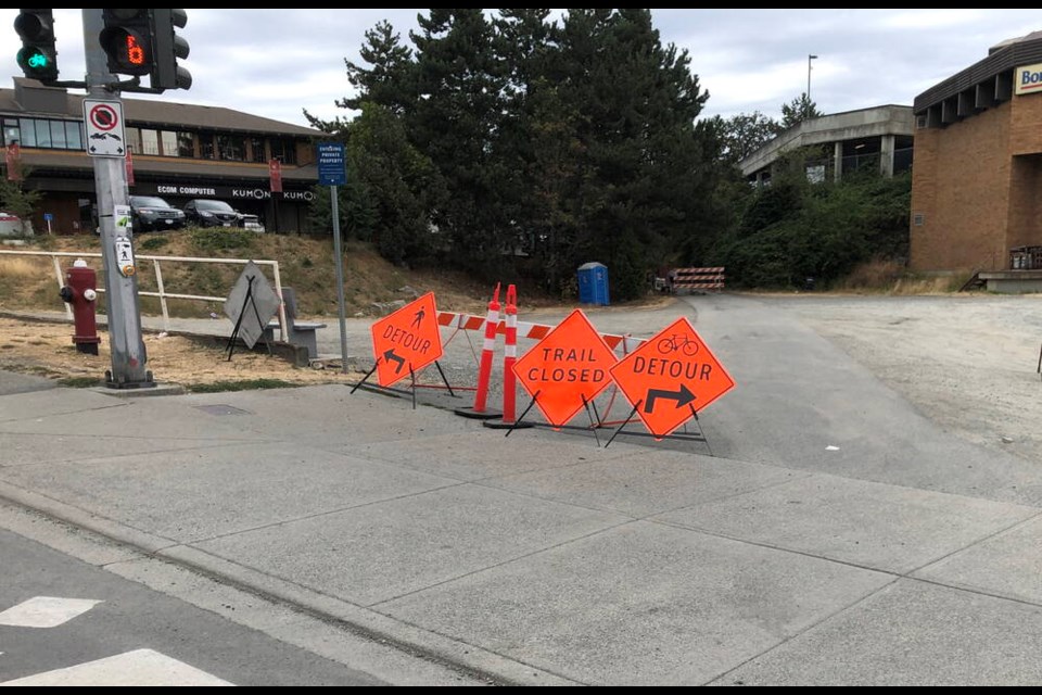 Signs advise of the Lochside Regional Trail detour at Quadra Street in Saanich in August 2022.    TIMES COLONIST