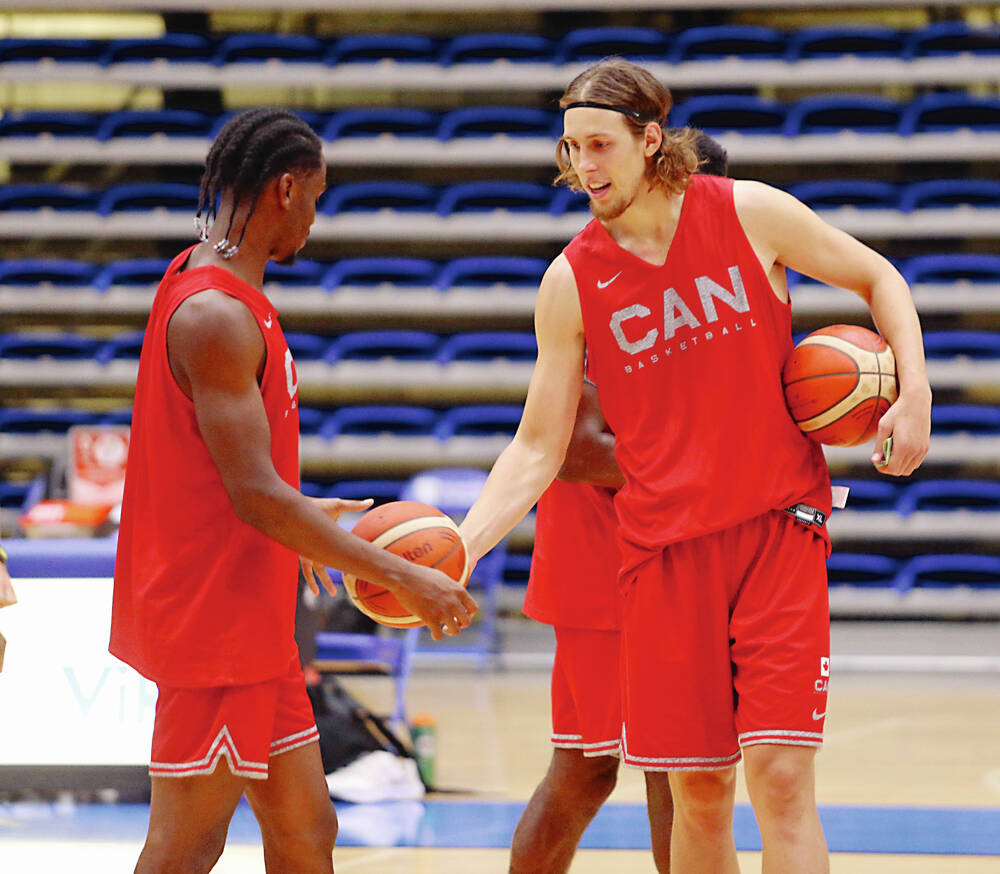 NBA players Dwight Powell and Kelly Olynyk during the Basketball