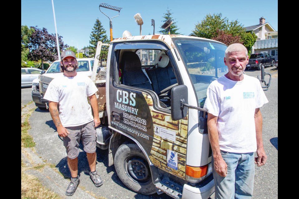 CBS Masonry colleagues Nick Lacoursiere, left, and Scott Clarke went to help after the fire broke out. 
DARREN STONE, TIMES COLONIST 