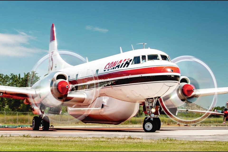 Longtime pilot Grahame Wilson and the 82-foot-long CV580, a large, twin-engine turboprop.  AARON BURTON | CONVAIR ABBOTSFORD 