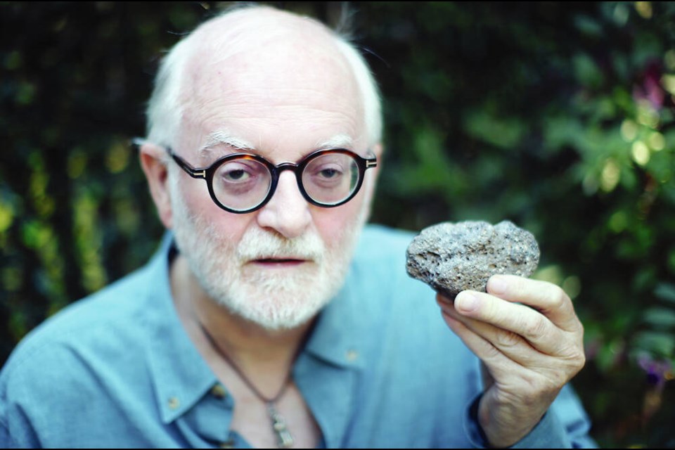 Former RBCM curator of archeology Grant Keddie with a bowl he made from vesicular basalt by pecking it out with a harder pointed stone. Keddie experiments in tool technology to understand how artifacts were made in the past. This type of rock was not common on the south coast but bowls were made from it around 2,000 years ago. ADRIAN LAM, TIMES COLONIST 