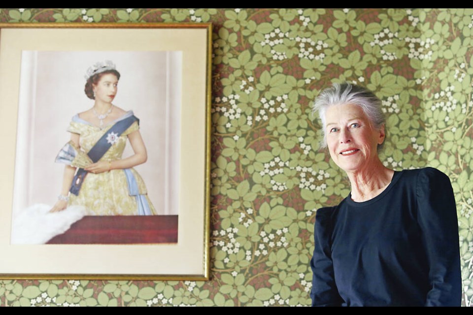Carolyn Sadowska with a portrait of the Queen. Sadowska has impersonated Queen Elizabeth II in commercials, at conventions, in parades and at innumerable parties for nearly four decades. ADRIAN LAM, TIMES COLONIST 