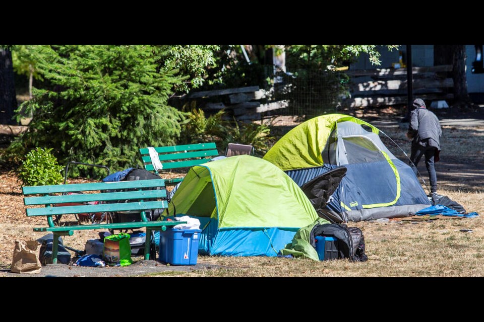 Tents in Stadacona Park, where 24-hour camping has continued beyond the May 1 deadline. A petition lists drug overdoses, violent crimes, intimidation of local residents, public urination and loud music among the issues neighbours have been facing. DARREN STONE, TIMES COLONIST