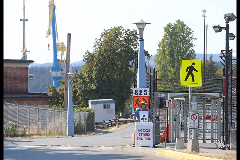 Workers picket in front of the Esquimalt Graving Docks on Friday. ADRIAN LAM, TIMES COLONIST 