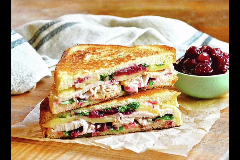A grilled sandwich, tastily stuffed with turkey, cheese, cranberry and a leafy green. ERIC AKIS 