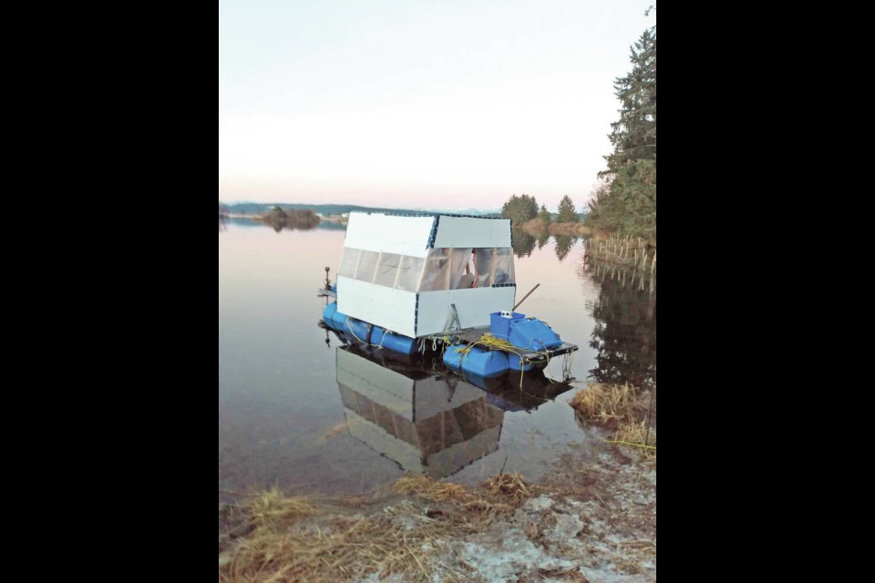Philip Hathaway dubbed his float home the Blue Dream. It's built with recycling bins and water bottles, bounded by a steel tubular frame and powered by a five horsepower motor. They've been living aboard since June 2021. PHILIP HATHAWAY 