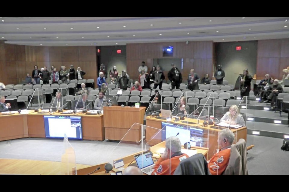 Frame-grab from Oct. 24 Nanaimo council meeting during which citizens were on their feet yelling at council. CITY OF NANAIMO 
