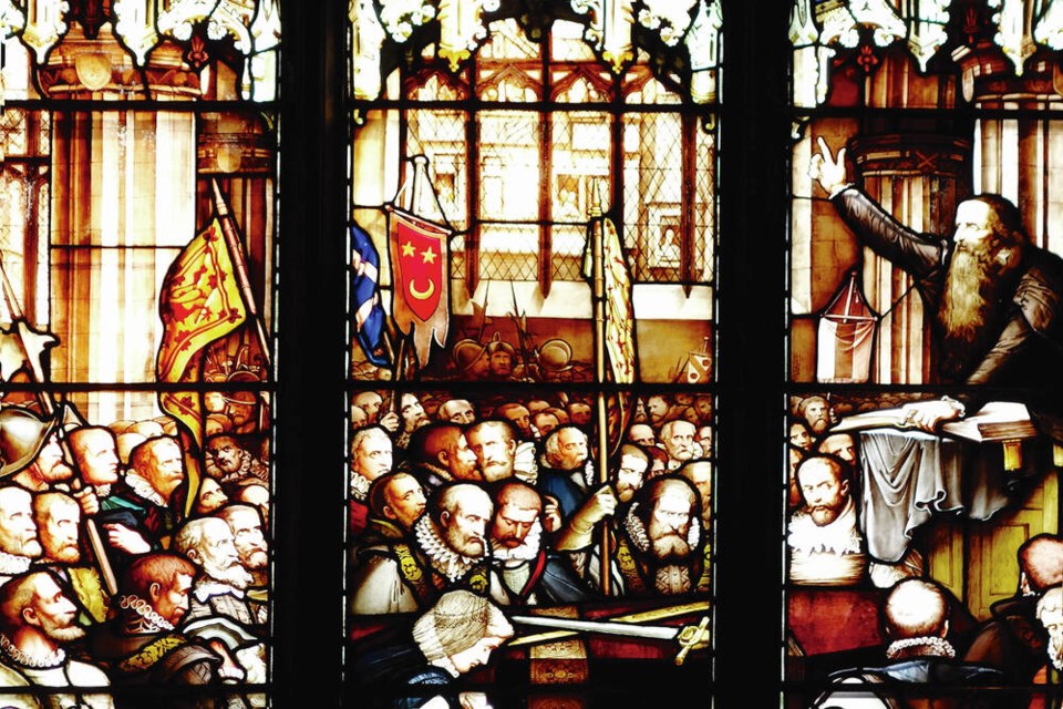 Despite preaching against anything that separated you from God, including stained glass, the reformer John Knox is commemorated in this stained-glass window at St. Giles' Cathedral. RICK STEVES 