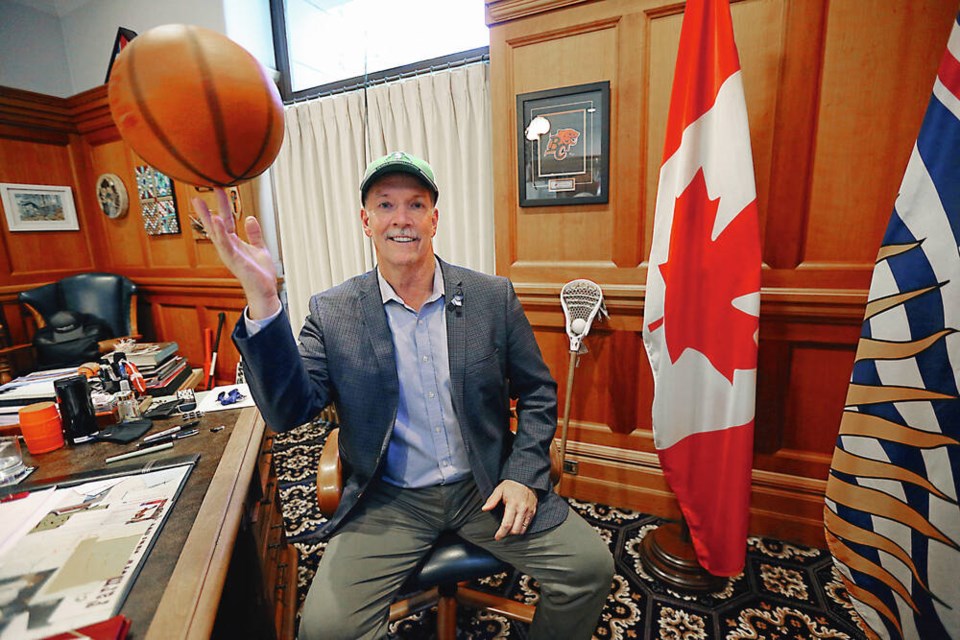 Premier John Horgan, a longtime sports fan, twirls a basketball at his office in the legislature. ADRIAN LAM, TIMES COLONIST 