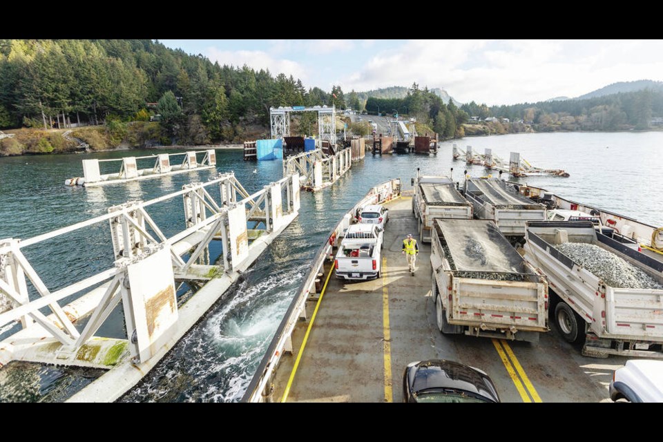 The Mayne Queen ferry approaches Village Bay Terminal on Mayne Island on Friday, Nov. 18, 2022, which several heavy construction vehicles on board. DARREN STONE, TIMES COLONIST