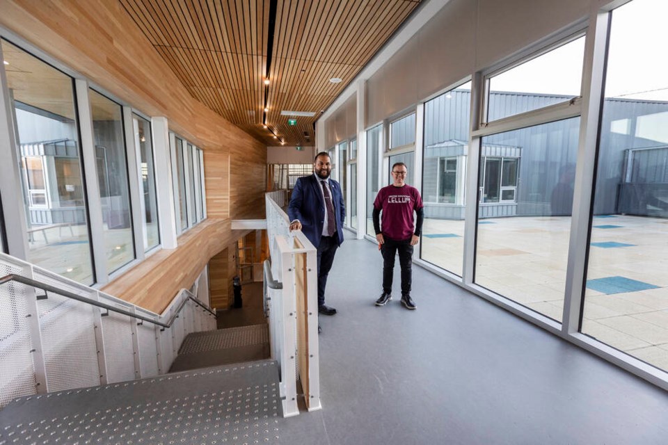 Sooke School District 62 chairman Ravi Parmar, left, and principal Darren Russell in the new Centre Mountain Lellum Middle School in Langford on Monday. DARREN STONE, TIMES COLONIST 
