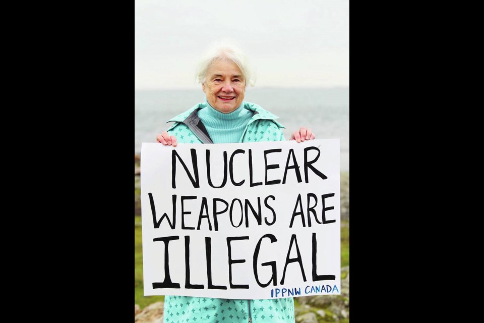 Dr. Mary-Wynne Ashford with a sign at Cattle Point in January 2021. Via Dr. Jonathan Down 
